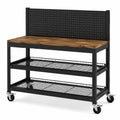 Établi mobile 120 × 60 × 150 cm en acier noir et bois d'ingénierie marron, 2 étagères, panneau perforé et roulettes